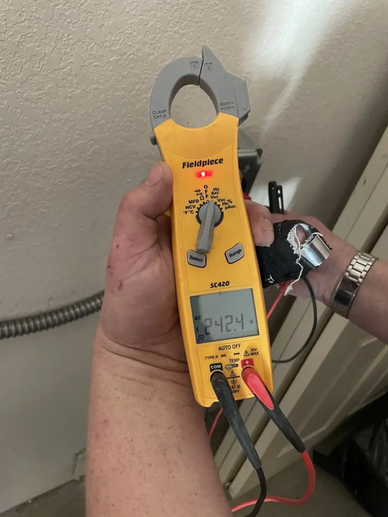 Voltage testing with clamp meter during Recessed Lighting Installation in Holly Springs